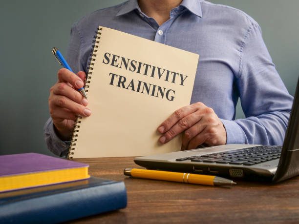 Sensitivity training concept. The manager holds the papers.